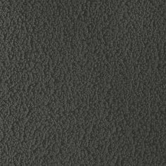 an up close view of the surface of a black leather textured material, with no pattern