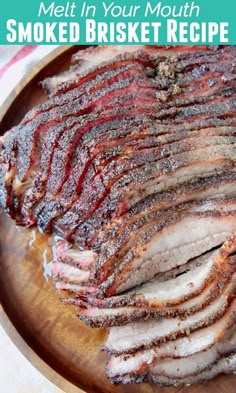 sliced meat on a wooden plate with text overlay that reads how to melt in your mouth smoked brisket recipe