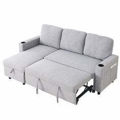 a grey couch with two recliners on it's back and one arm extended