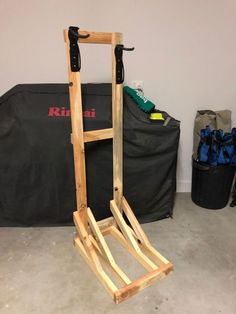 a wooden ladder leaning against a wall in a room with other items on the floor