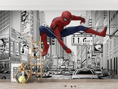 a spiderman wall mural in an empty room with a ladder and chair next to it