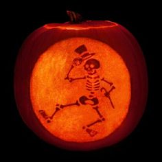 a carved pumpkin with a skeleton on it