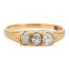 an antique three stone ring with two diamonds on the front and one diamond in the back