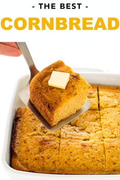 the best cornbread is in a white casserole dish with butter on top