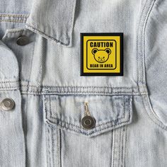 a badge on the back of a jean jacket that says team groom with an arrow