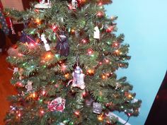 a small christmas tree is decorated with ornaments