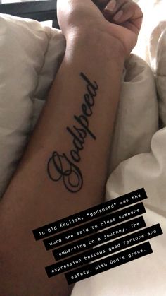 a person laying in bed with a tattoo on their arm and the words beneath them