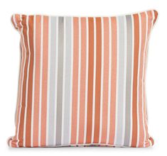 an orange and grey striped pillow on a white background