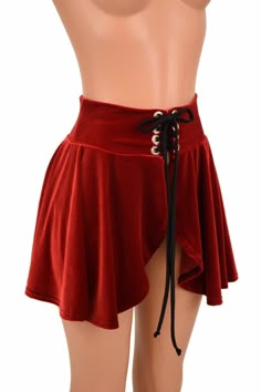 "This item is made to order, please read all the way through the listing before purchasing! This 15\" long circle cut skirt has a lace-up at the waistband. This one is made of red velvet, with a smooth black spandex tie. Perfect for matching with our cheekies, shorts and crops, or wear it over leggings The skirt is open below the laceup, so be sure to wear something cute underneath! Womens Sizing (See below for instructions on where measurements should be taken) XXS: Bust 29\"-30\" / Waist 22\"- Lace Up High Waist Skirt, Red Highlow Skirt, Cheap Red Skirt For Festival, Luxury Red Asymmetrical Skirt, Fitted Mini Skirt For Halloween Costume Party, Skirt Rave Outfit, Simple Rave Outfits, Salsa Costumes, Grunge Emo Aesthetic