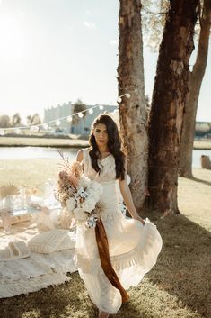 a woman in a white dress holding a bouquet