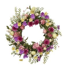 a wreath with purple and yellow flowers on it, including an egg in the center