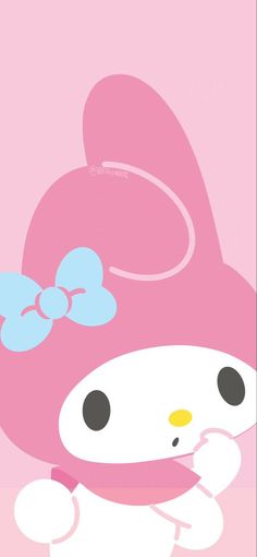 the hello kitty wallpaper is pink and has a blue bow on it's head