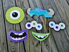 monster cupcake toppers on a wooden table