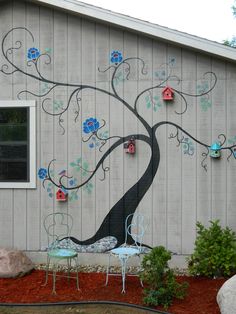 a tree painted on the side of a building