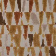 an orange, brown and white pattern on fabric