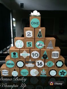 a cake made out of cardboard boxes with numbers on it and decorations around the top