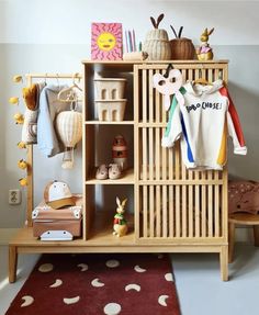 a baby's room with toys and decor on the shelves