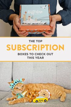 an orange cat laying on top of a couch next to a box that says the top subscription boxes to check out this year