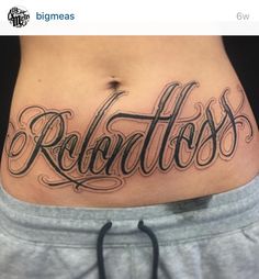 a woman's stomach with the word radonloss tattooed on her side