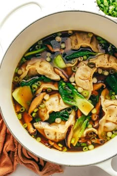 a white bowl filled with soup on top of a table