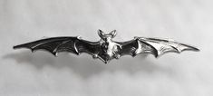 A fabulous Vampire Bat brooch, silver plated on stamped brass, long and sleek brooch. There are also co-ordinating earrings listed for pierced ears and a Bats bracelet A new yet vintage brooch/ pin taken from an original stamp created in France over 100 years ago. How can this brooch be vintage and new at the same time? It has 3 levels of history attached to it The metal stamp was originally created in the Marais district in Paris where the jewellery making skills were lost in the battlefields o Vampire Bat, Ear Earrings, Vintage Brooch, Pierced Ears, Battlefield, Jewellery Making, Metal Stamping, Vintage Brooches, Christmas Presents