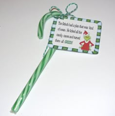 a green and white lollipop with a dr seusst quote on it