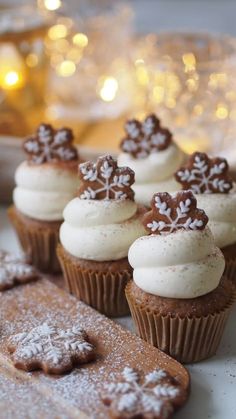 some cupcakes are sitting on a table