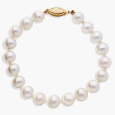 Nearly round, these freshwater cultured pearls are strung securely on a 6.5" hand-knotted silk blend cord and secured with a 14k yellow gold safety clasp.