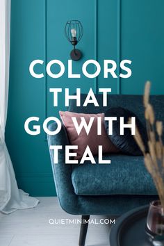 a blue couch with the words colors that go with teal in front of it