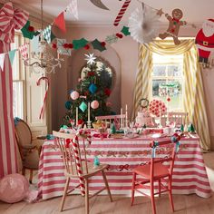 a decorated christmas table with candy canes and decorations