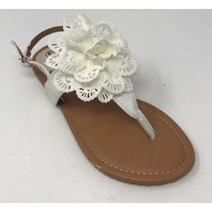 A pair of VictoriaK Sandals with fashionable knitted embossed flower on front, offers a combination of comfort and style. The rubber sole adds stability. This trendy sleek and chic look wears well anytime through out the day or a night out in the town. An elegant pair ofVictoria Ksandals add flair to your everyday wardrobe and these come in a range of colors. Size: 7. Color: White. Gender: female. Age Group: adult. Pattern: floral. Adjustable Flower Sandals, Shower Sandals, Floral Sandals, In The Town, Beach Slippers, Fashion Sandals, Flower Applique, Sandals Women, White Crochet