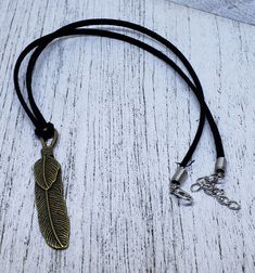 Symbol Of Protection, Feather Necklace, Jewelry Accessories Ideas, Jewellery Ideas, Suede Cord, Feather Charms, Accessories Ideas, A Symbol, Feather Necklaces