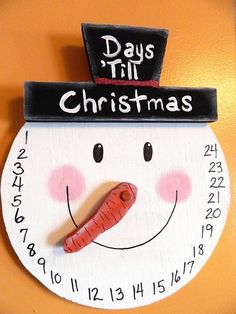 an image of a snowman with a hat on it's head that says days till christmas