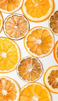 orange slices cut in half on a white surface