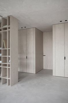 an empty room with several bookshelves in it