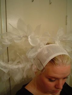 a woman wearing a white turban over her head