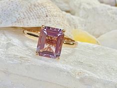 This classic cathedral solitaire setting contains a beautiful 3.00ct natural Rose De France amethyst. The emerald cut stone measures approximately 10x8mm and the band is 2mm wide. The ring is available in sterling silver, and 14k white, yellow, or rose gold. This ring makes a unique promise or engagement ring. Please send me a message if you need a size not listed. * This ring can be customized with any color center stone. All items are handmade by me in my shop in Manalapan, NJ. Please message Lavender Amethyst Solitaire Ring As A Gift, Lavender Amethyst Solitaire Ring For Gift, Lavender Ring, Amethyst Cathedral, Cathedral Setting, Ring Emerald Cut, Lavender Amethyst, Amethyst Ring Engagement, Cushion Cut Engagement