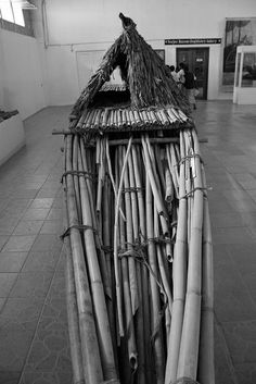 there is a large bamboo structure made out of sticks and other things in the room