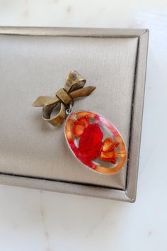 Vintage Resin Red Rose Bow Brooch. Length: 1 3/4" Width: 7/8" Vintage condition! please zoom in. Back to the shop: https://www.etsy.com/shop/SusVintage?ref=hdr_shop_menu If you have any questions feel free to contact me. Thank you!! Vintage Red Pins For Gifts, Vintage Red Pins For Gift, Vintage Red Pins As Gift, Handmade Vintage Red Brooches, Red Brooch Jewelry For Valentine's Day, Red Valentine's Day Brooch, Red Brooch Pins For Valentine's Day, Red Brooches For Valentine's Day, Red Brooch For Anniversary On Valentine's Day