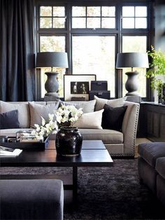 a living room filled with furniture and lamps