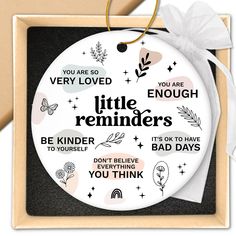 a round ornament with the words, you are loved and little reminders