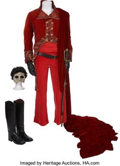 an image of a man in red outfit with boots and headpieces on display