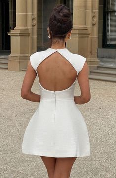 the back of a woman in a white dress