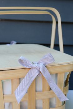 a wicker basket with a ribbon tied around it