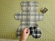 someone is making a teddy bear out of fabric