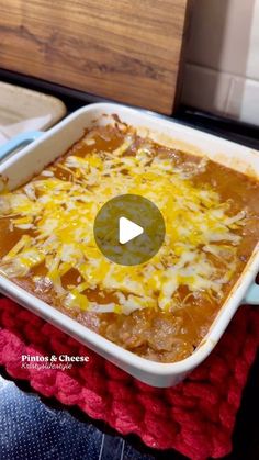 a casserole dish with cheese and meat in it