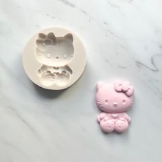 Perfect for chocolate , fondant, or gum paste This product measures approximately: W: 1 1/2" L: 2 1/4" Hello Kitty Resin Mold, Hello Kitty Resin, Decoden Case, Minnie Bow, Face Mold, Kitty Stuff, Buy Pearls, Kitty Drawing, Baseball Theme