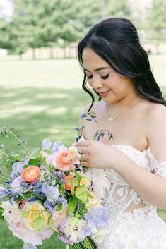 a woman in a wedding dress holding a bouquet