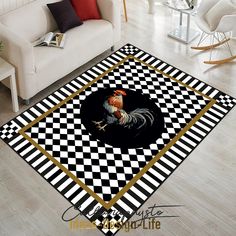 a living room area rug with a rooster on the checkerboard pattern in black and white