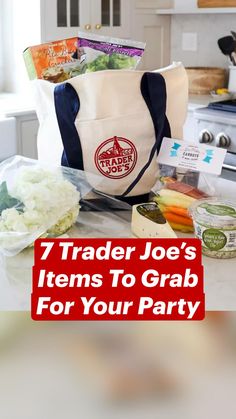 a grocery bag sitting on top of a counter next to vegetables and other food items